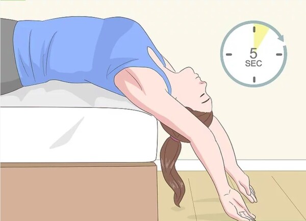 step-1-stretch-your-back-over-the-edge-of-your-bed